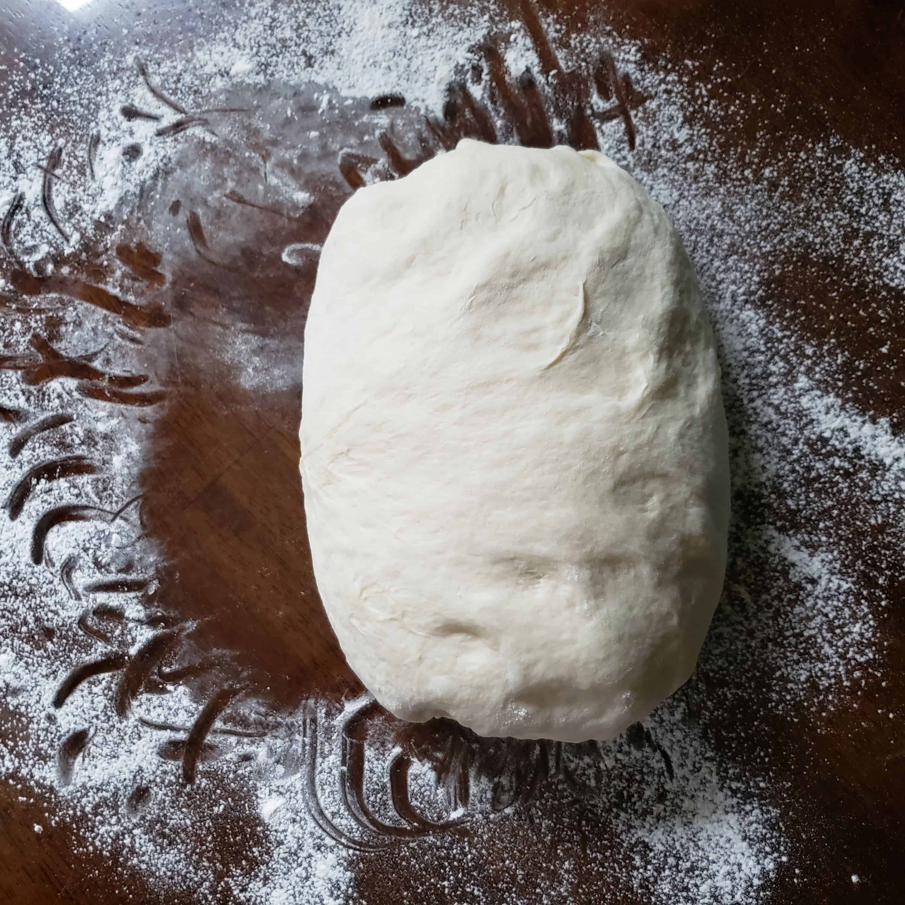 Shape 6 Dough on table being kneaded